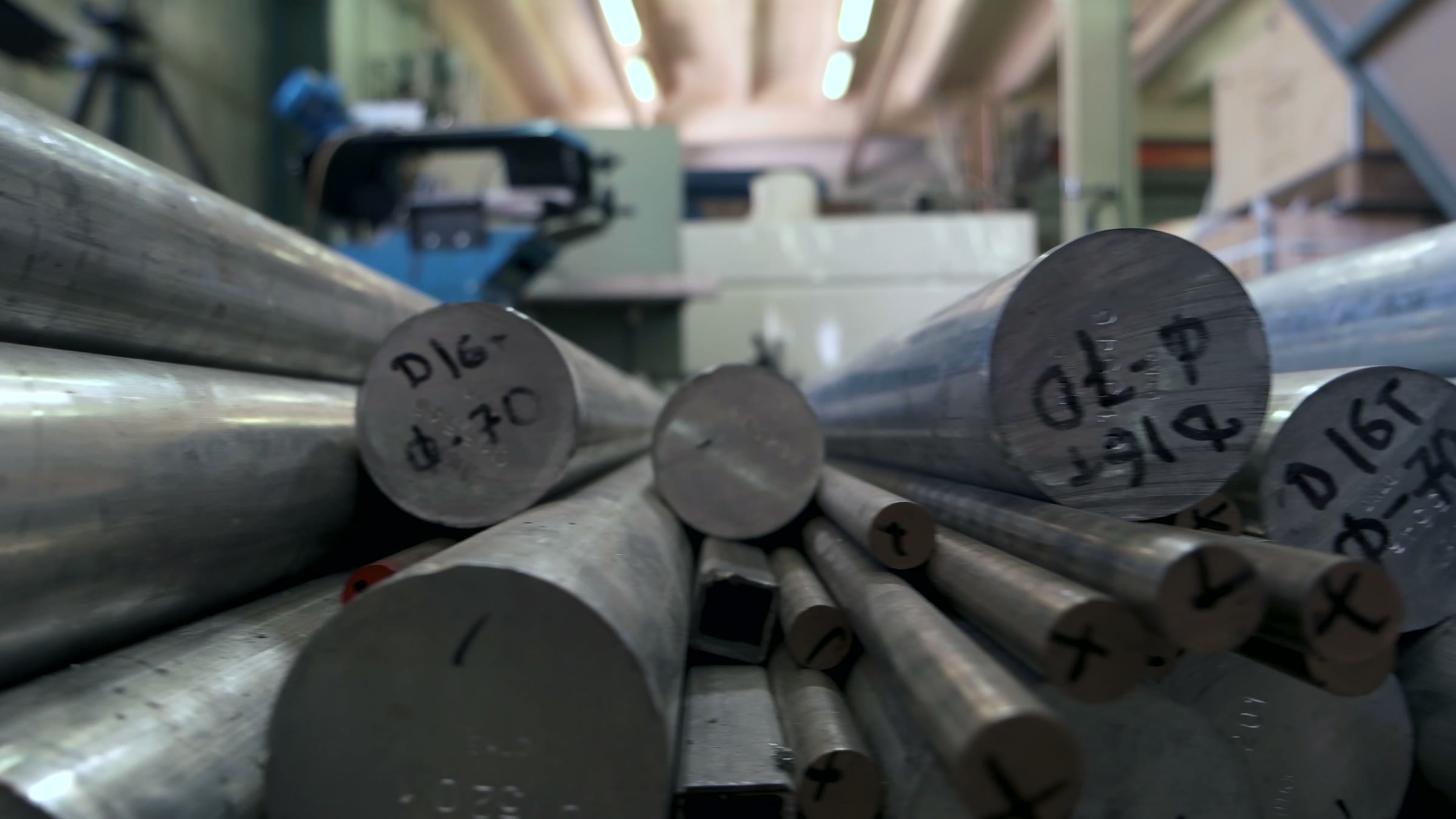 Metal stock marked with grade and diameter notes